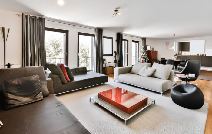 Spacious furnished apartment living room with seating and dining area