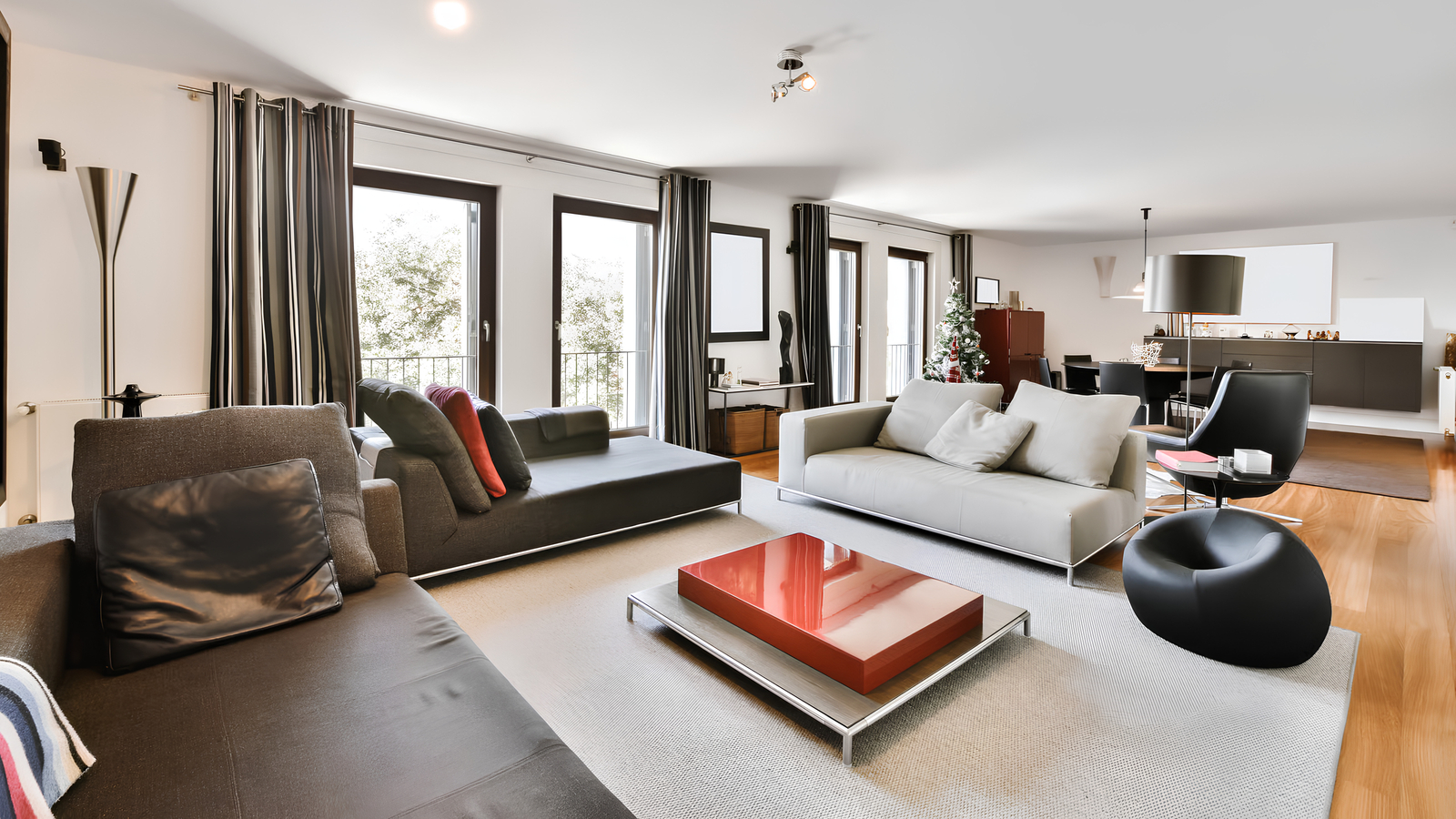 Spacious furnished apartment living room with seating and dining area